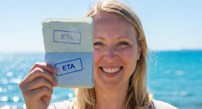 Adult language study holidays in England Brighton with LISA! – entry requirements and ETA Adult participant holding ETA entry document in Brighton during a LISA! language study holiday in England