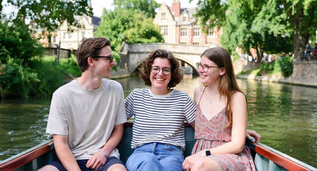 Adult participants of a LISA! language study holiday in Cambridge City England enjoying a boat trip on the river