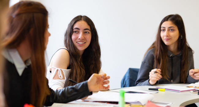  Adults in an English course in Cambridge City England during a LISA! language study holiday learning together and interacting