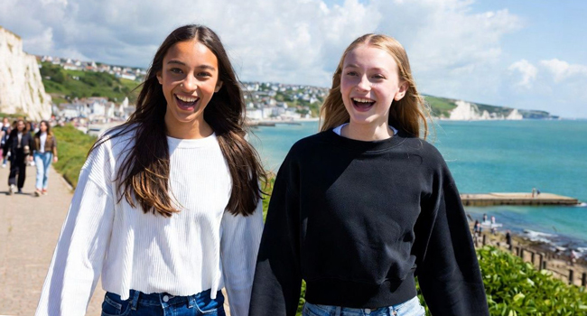 Two schoolgirls in Eastbourne England during a LISA! language study holiday along the coast with sea view