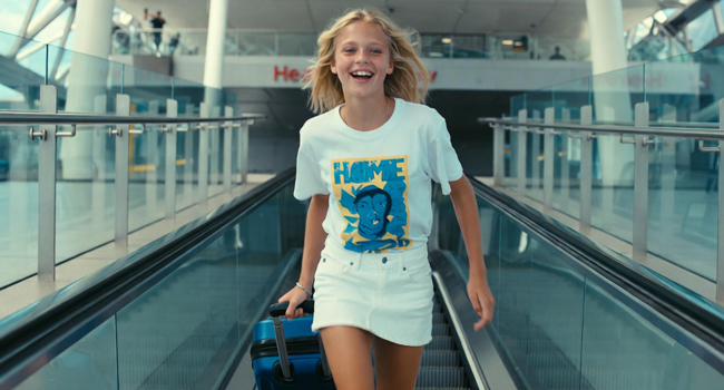  Schoolgirl with suitcase arriving in Exmouth during a LISA! language study holiday excited for her stay
