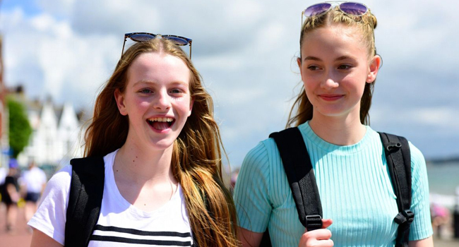  Schoolgirls in Exmouth during a LISA! language study holiday walking by the sea and enjoying their free time