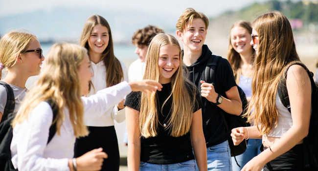 Group of students in Jersey during a LISA! language study holiday on the beach enjoying supervised activities together