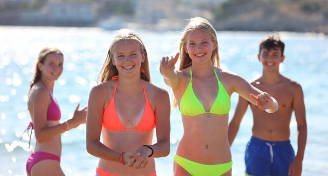 Students on the beach in Jersey during a LISA! language study holiday enjoying the sea, sun and time together