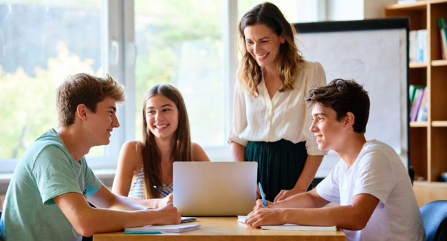  Students in an English lesson in Jersey during a LISA! language study holiday learning together in class with a teacher