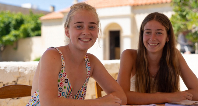 Student language study holidays in Malta with LISA! – learning English together Two female students studying together during a LISA! language study holiday for students in Malta
