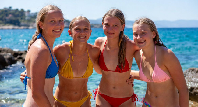 Entry into Malta for a language study holiday for students in San Gwann with LISA! Four girls by the sea in colourful bikinis on a language study holiday in Malta San Gwann