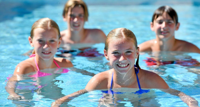 Student language study holidays in Malta with LISA! – students in the accommodation pool Four students in the accommodation pool during a LISA! language study holiday for students in Malta