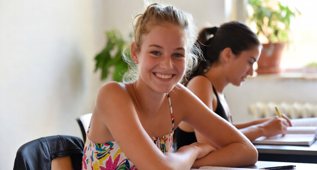 Student language study holidays in Malta with LISA! – learning English in class Female student in an English lesson during a LISA! language study holiday for students in Malta
