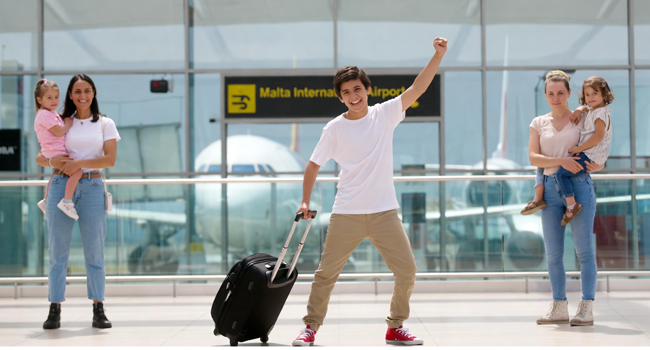 English language study holidays in Malta for students with arrival via the airport Students on an English language study holiday in Malta arriving at the airport with a suitcase and welcome scene