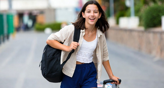 Arrival in Trieste for a LISA! Italian language course for young learners Young student arriving with a suitcase for a LISA! Italian language course for young learners in Trieste, Italy